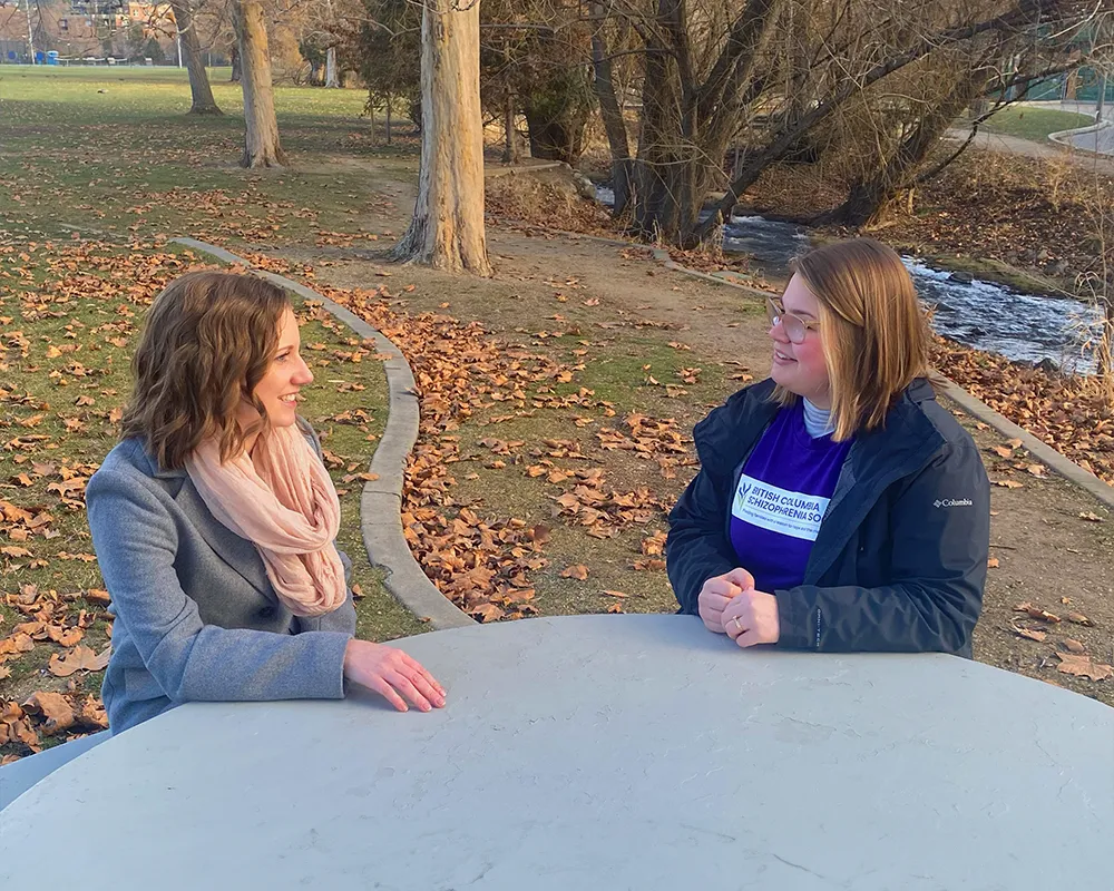 Christine talking with a British Columbia Schizophrenia Society volunteer